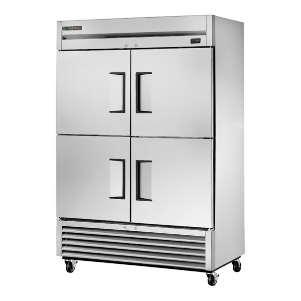 A stainless steel True reach-in refrigerator with black handles.