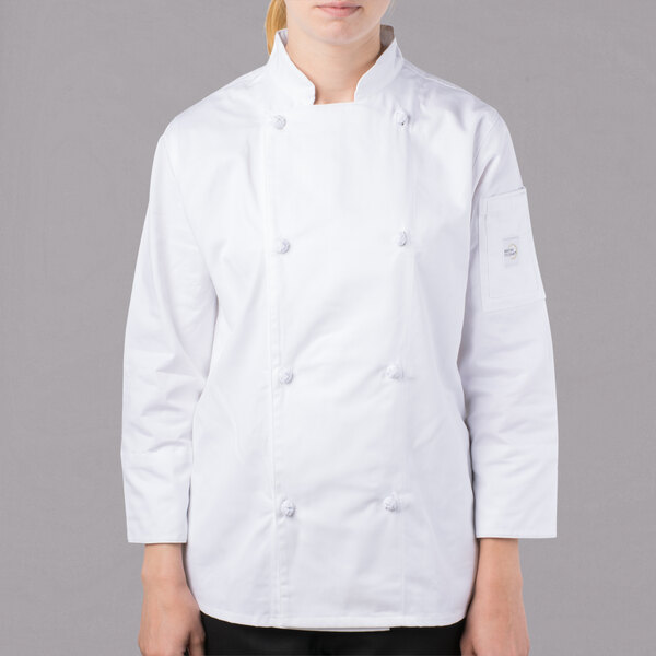 A young woman wearing a white Mercer Culinary chef jacket.
