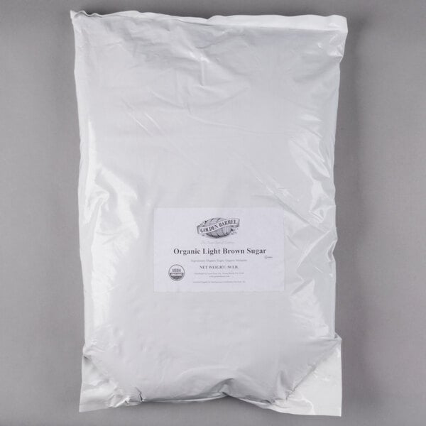 A bag of Golden Barrel Organic Light Brown Sugar with white background.