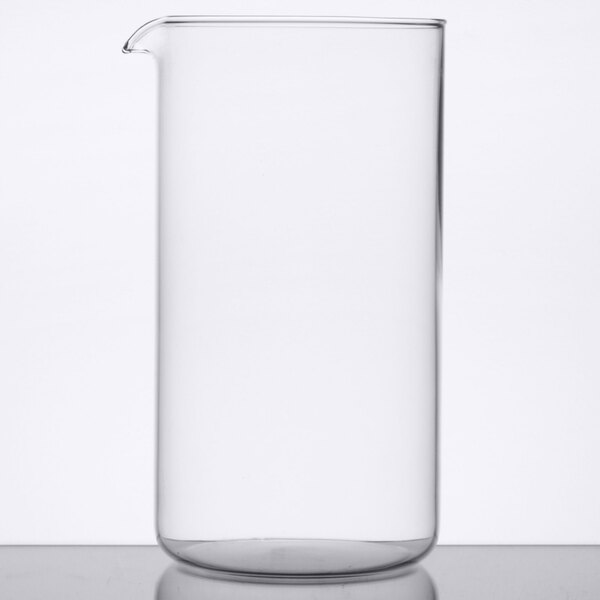 A clear glass Libbey French press carafe on a table.