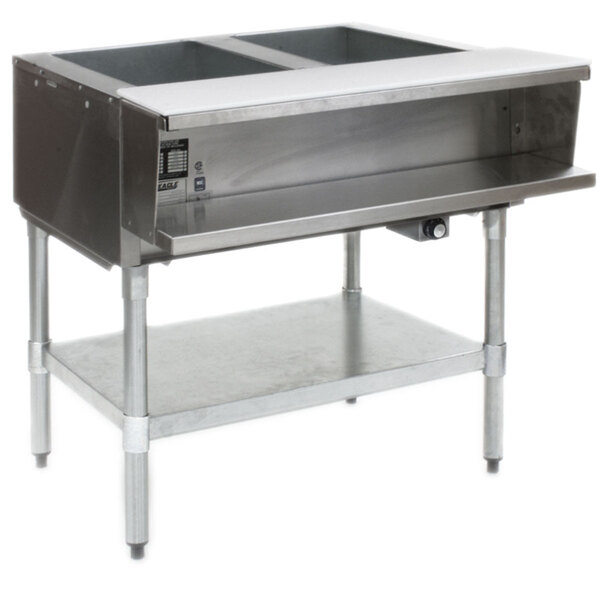 A stainless steel Eagle Group liquid propane steam table with galvanized legs over a counter.