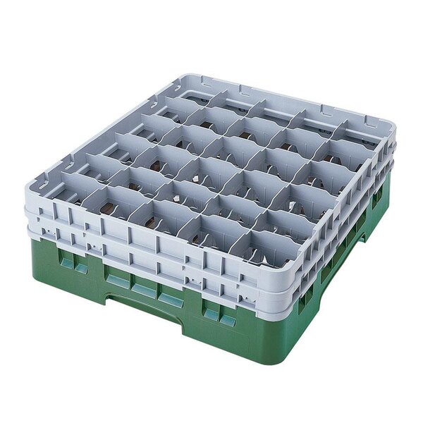 A white plastic Cambro tray with green compartments for glasses.