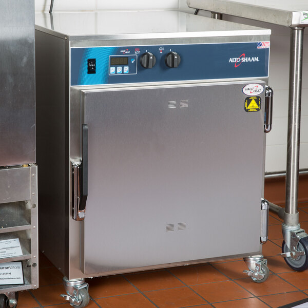 A large stainless steel Alto-Shaam undercounter cook and hold oven with a blue door.
