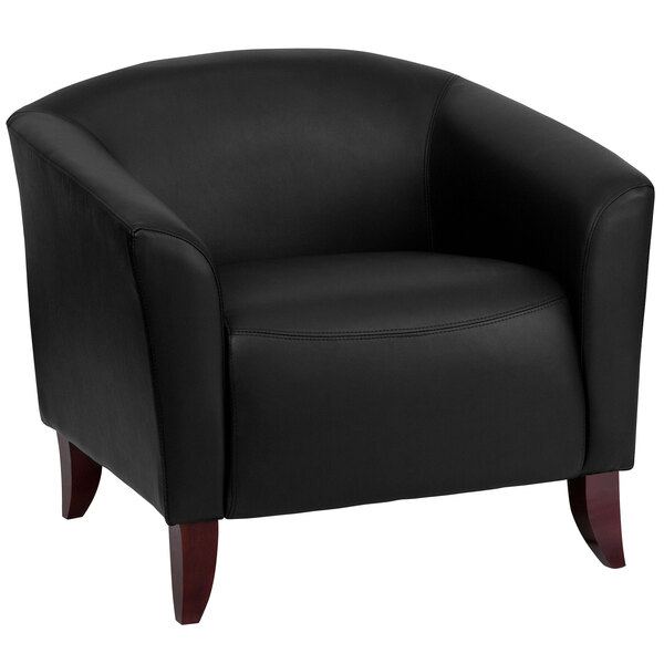 A Flash Furniture black leather chair with wooden legs.