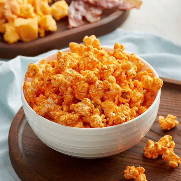 A wooden bowl filled with Grandma Jack's Gourmet Bacon Cheddar Popcorn.