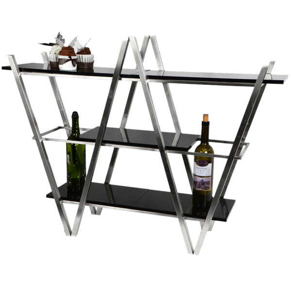 An Eastern Tabletop stainless steel 3 tier table display stand with black acrylic shelves holding wine bottles and cupcakes.