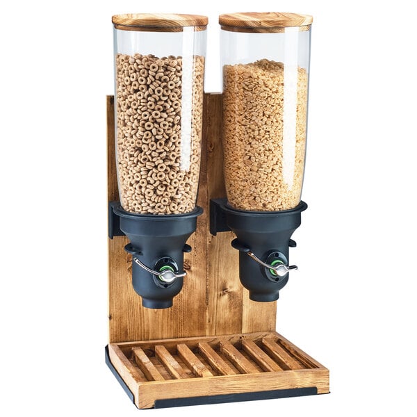 A Cal-Mil Madera double cereal dispenser with wooden canisters full of cereal.