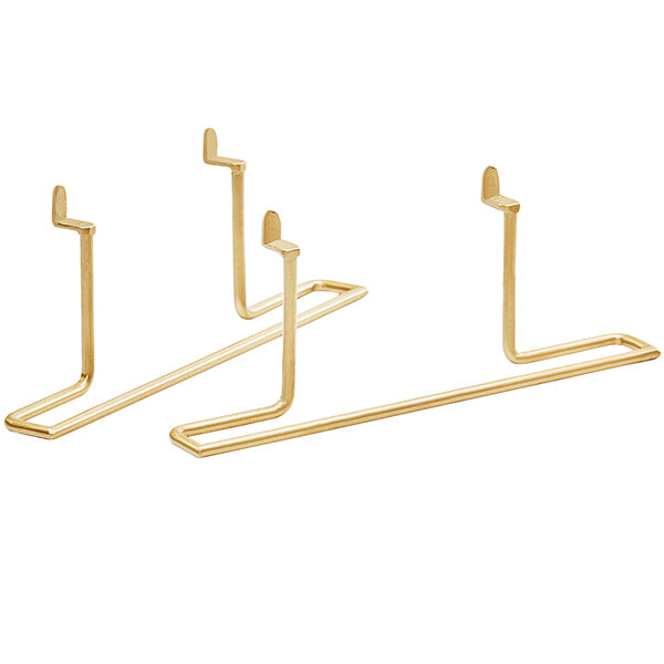 A close-up of two gold metal Cal-Mil shelf brackets.