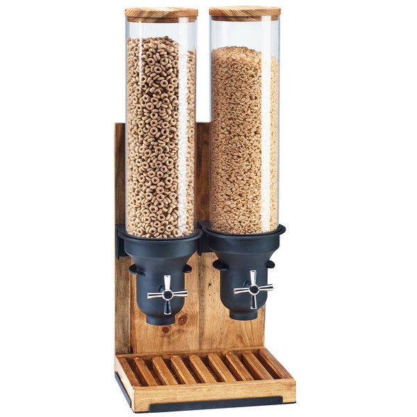 A Cal-Mil Madera double cereal dispenser with two glass containers full of cereal.