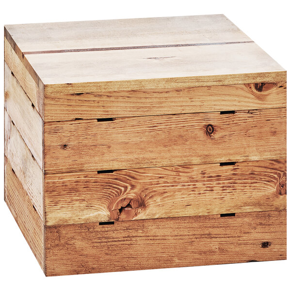A Cal-Mil Madera rustic pine square crate riser on a table.