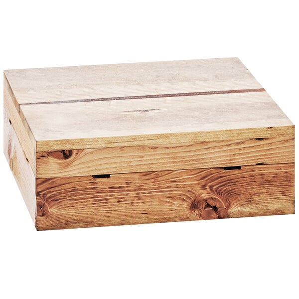 A Cal-Mil Madera Rustic Pine square crate riser on a table.