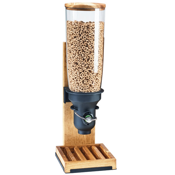 A Cal-Mil Madera cereal dispenser with a wooden stand and a glass jar of cereal.
