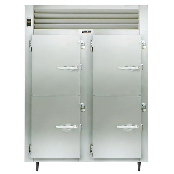 A white Traulsen holding cabinet with two half doors open.