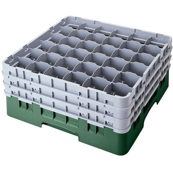 A white plastic Cambro glass rack with green dividers.
