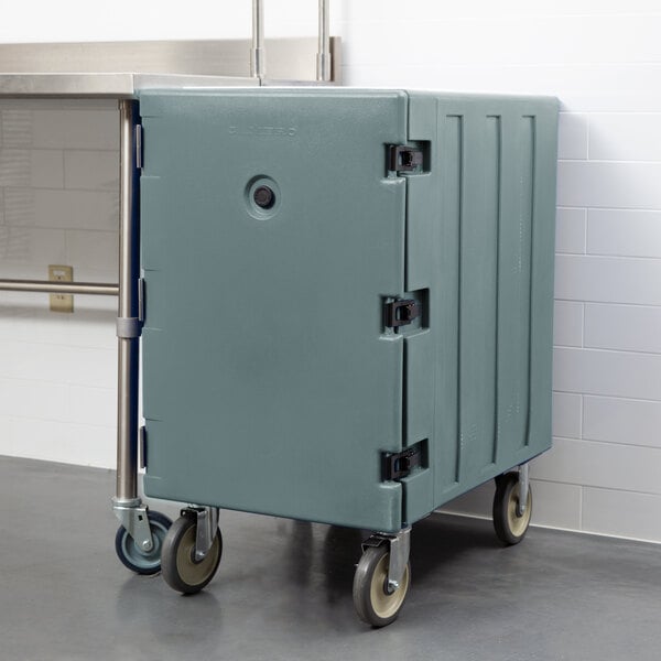 A large slate blue plastic container on wheels.