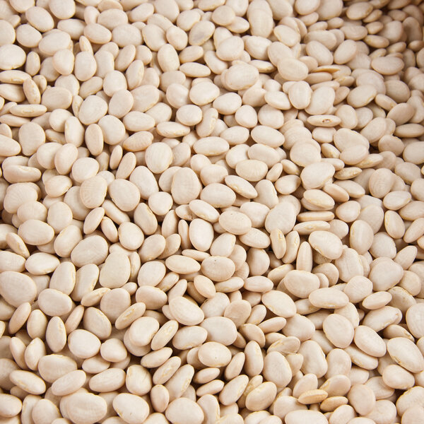 A pile of dried small lima beans.