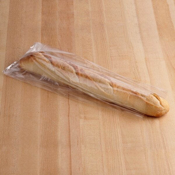 A loaf of bread wrapped in an Inteplast Group plastic bag.