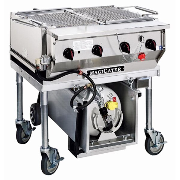 A large stainless steel MagiKitch'n MagiCater portable outdoor grill on wheels.