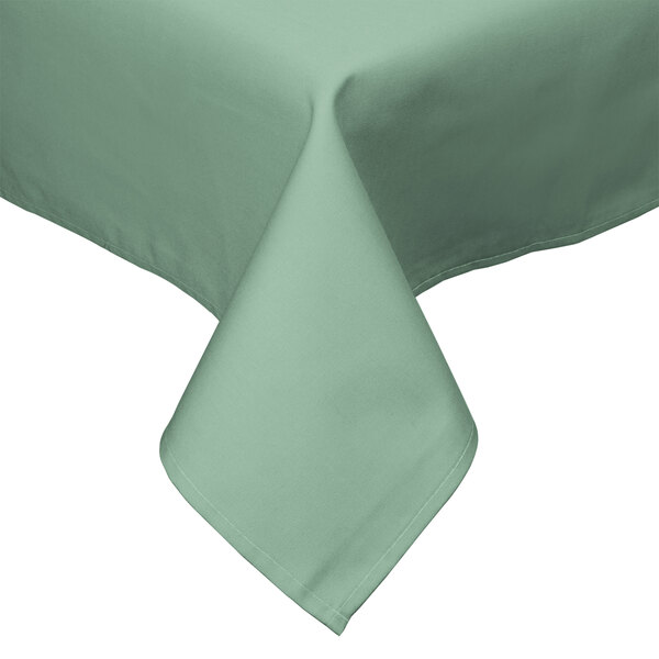 A seafoam green Intedge tablecloth with a hemmed border on a table.