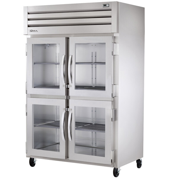 A True stainless steel 2 section heated holding cabinet with glass doors.
