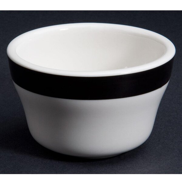A black stoneware bowl with a white rim.
