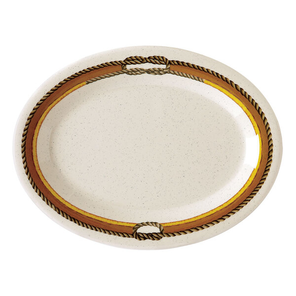 A white oval platter with a brown and gold diamond rope border.