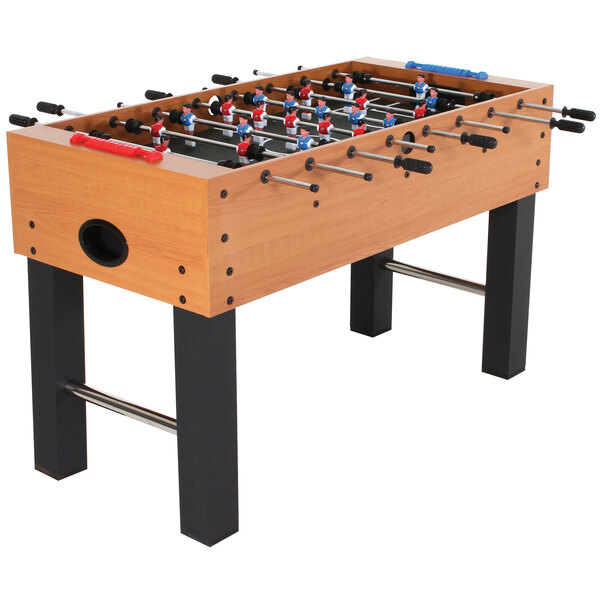 An American Legend foosball table with red and blue foosballs on it.