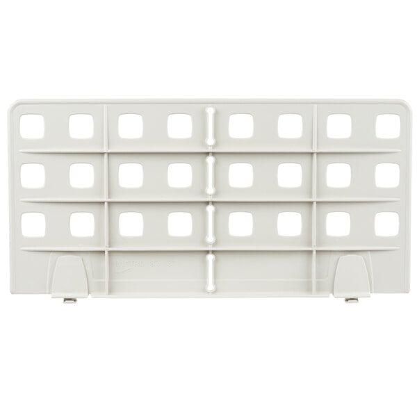 A white plastic Metro shelf divider with square holes.