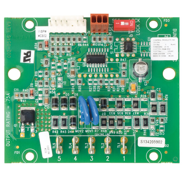 A green circuit board with many small components.