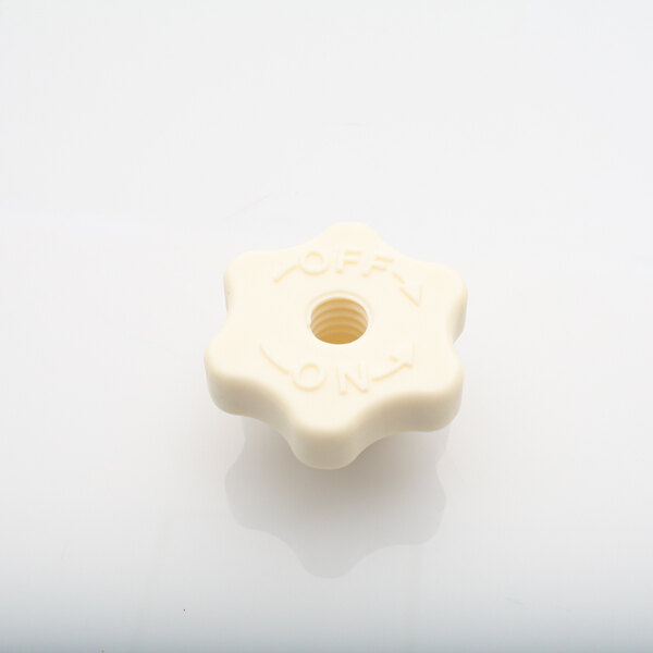 A white plastic Hobart Twist Lock Knob with a star and a nut.