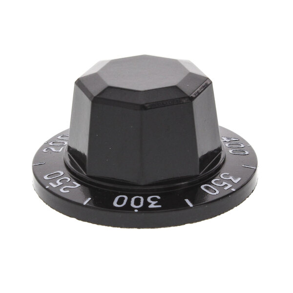 A black plastic knob with white text.