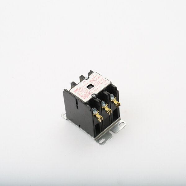 A black and white electrical contactor with gold buttons.