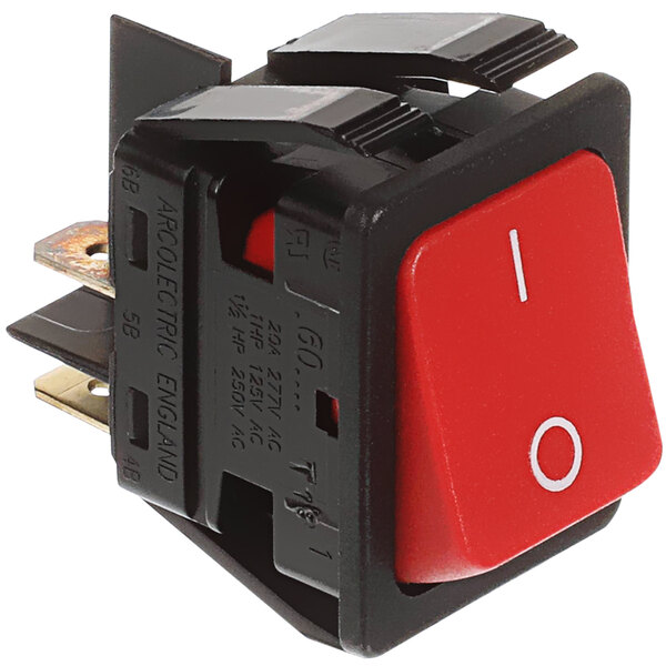 A close-up of a red Delfield toggle switch with a black plastic holder and white text.