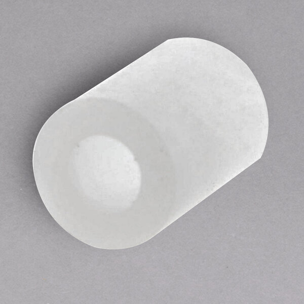 A white plastic Bizerba Spacer with a round center.