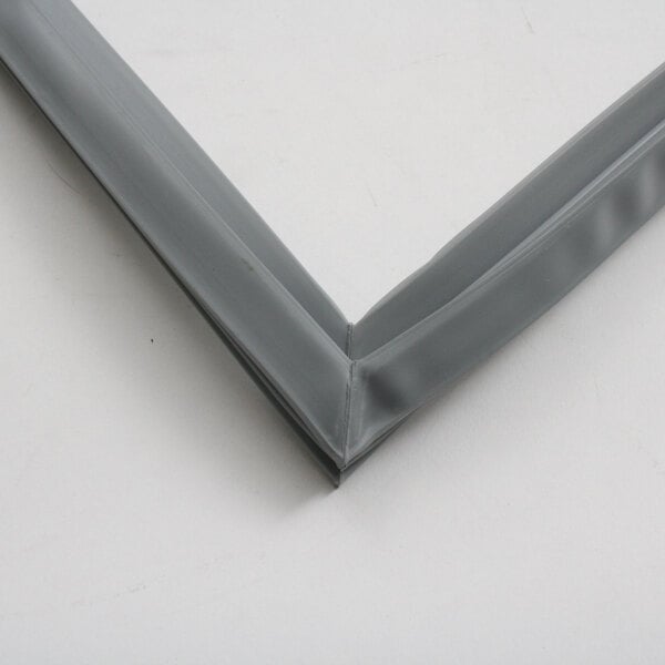 A close-up of a grey rubber strip on a metal frame.