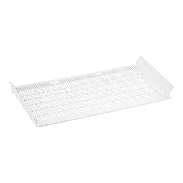 A white plastic grid with holes on a white shelf.