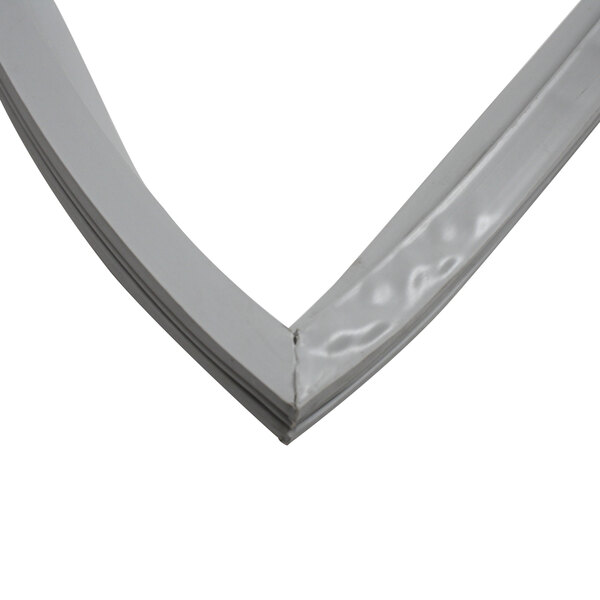 A close-up of a white plastic and silver metal Master-Bilt door gasket corner.