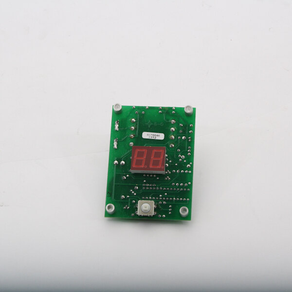 A green circuit board with a red digital display.