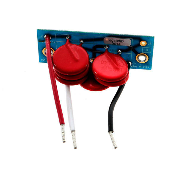 A red Antunes Varistor Board with black and red electronic components.