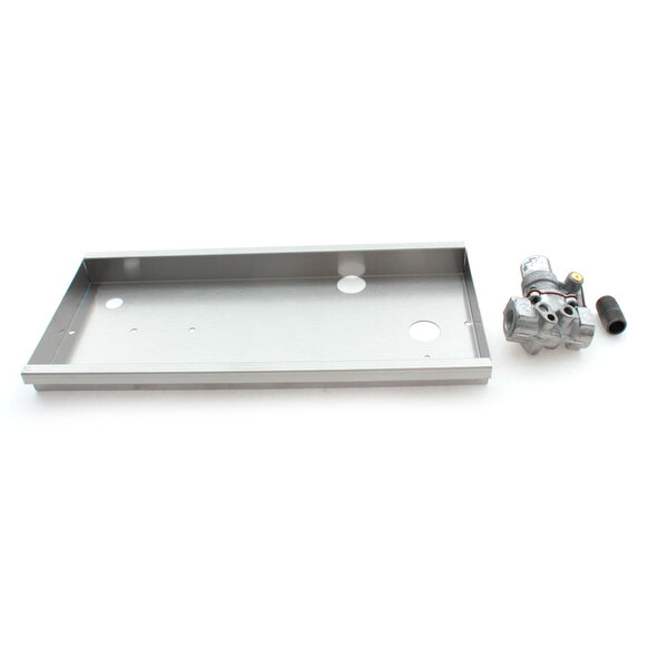 A metal tray with a white rectangular metal box on top with a hole in the middle.
