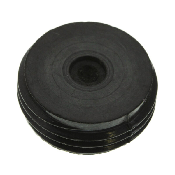 A black round rubber cap with a hole in the center.