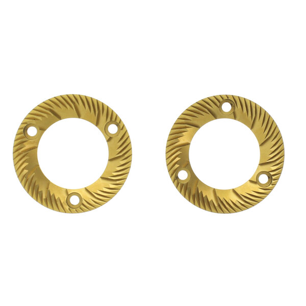 A pair of circular gold burrs with holes.