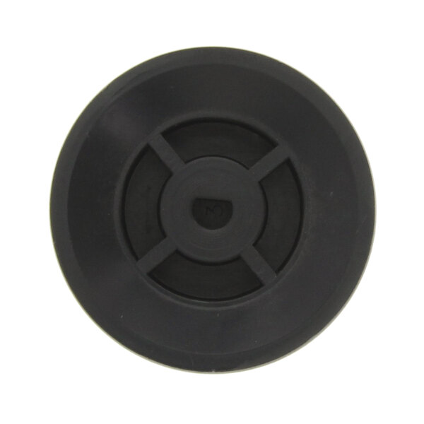 A black circular plastic dial with a hole in the center.