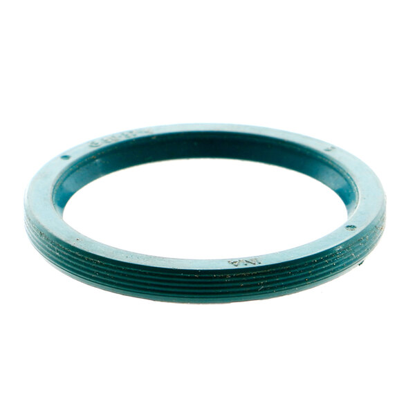 A close-up of a green rubber oil seal.