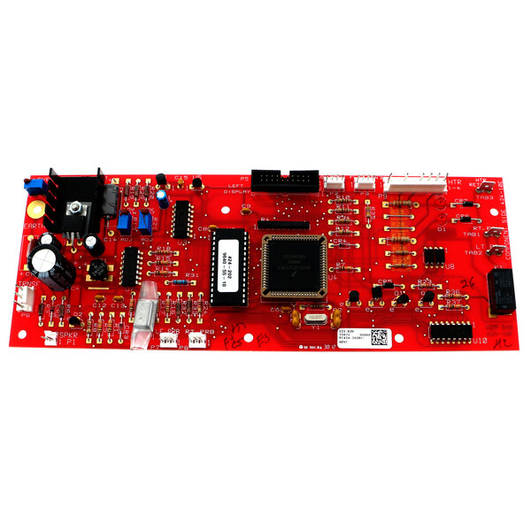 A red circuit board with many different components.