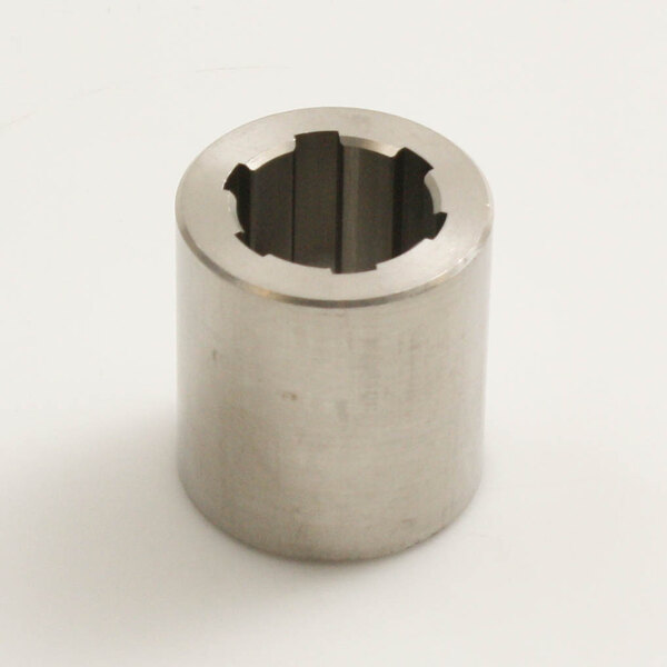 A close-up of a stainless steel metal cylinder with a hole.