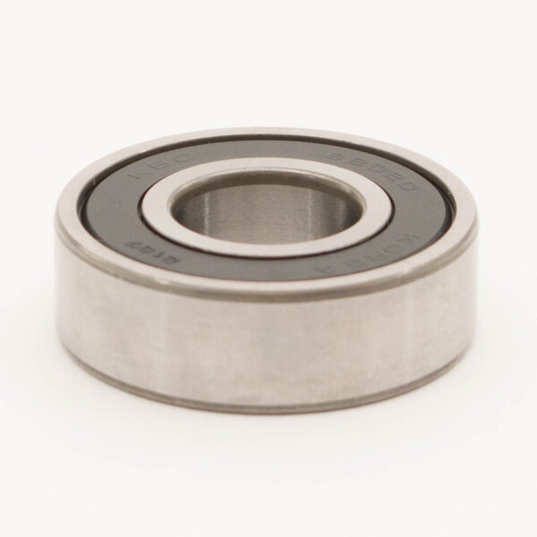 A close-up of a Univex bearing with a hole in the middle.