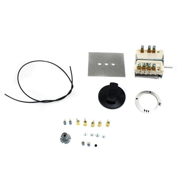 A US Range switch replacement kit with a motor and other parts.