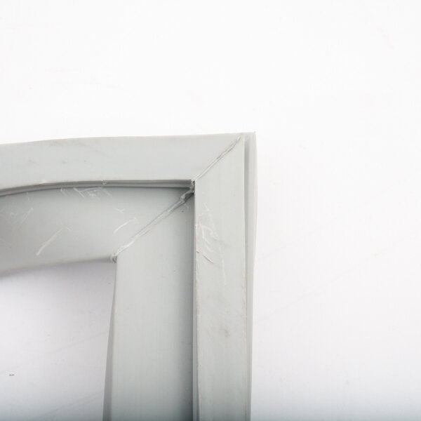A close-up of a white Victory door gasket corner with a gray frame.