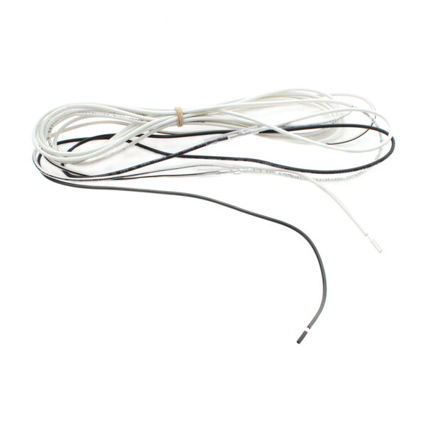 A close-up of a bundle of black and white wires with a white cord.